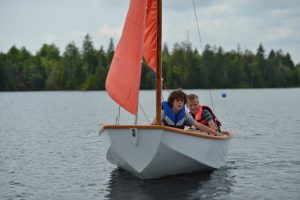 Sailing camp students enjoying a day on the water on Keenes Lake
